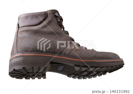 Men brown suede hybrid sneaker boot isolated on white background. Casual winter leather ankle hiking boot with rugged sole, side view. Men brown suede hybrid sneaker boot isolated on white background. Casual winter leather ankle hiking boot with rugged sole, side view. 140131992