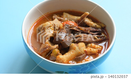 rice vermicelli with northern thai curry sauce on blue background rice vermicelli with northern thai curry sauce on blue background 140132037