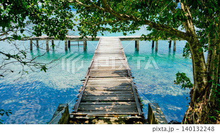 beautiful view of tropical beach with mountain backdrop and clear sky 140132248