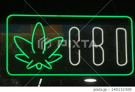 Neon Sign in Window of Vape Shop 140132300