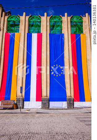 Large flags hang on building facade. Flags include European Union and Armenia Large flags hang on building facade. Flags include European Union and Armenia 140136381