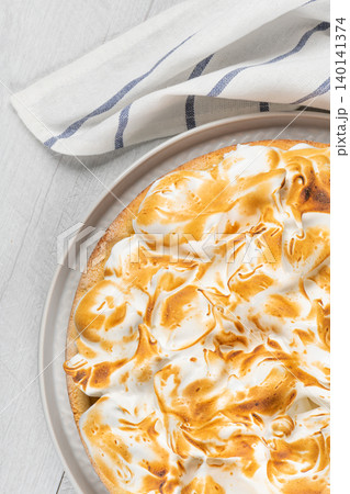 Lemon tart pie with meringue cream. Traditional American cake. Homemade baking. Copy space Lemon tart pie with meringue cream. Traditional American cake. Homemade baking. Copy space 140141374