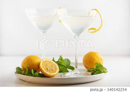 French 75 cocktails presented with lemon and mint garnish 140142254