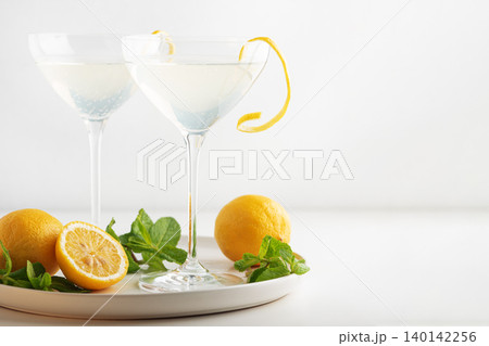 French 75 cocktails presented with lemon and mint garnish 140142256