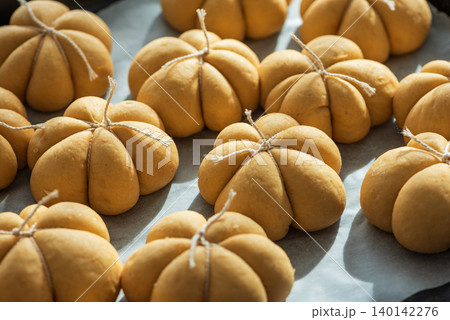 Pumpkin spice bread buns baking for autumn holidays 140142276