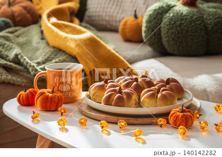 Cozy autumn home atmosphere with pumpkin buns and decor Cozy autumn home atmosphere with pumpkin buns and decor 140142282
