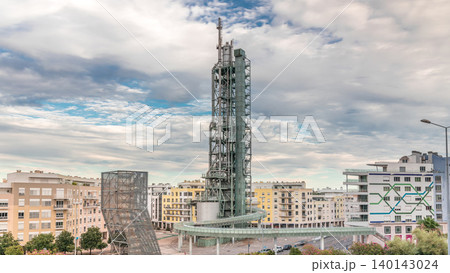 Timelapse hyperlapse of old steel refinery tower with spiral ramp in Lisbon's Park of Nations modern district. Portugal 140143024