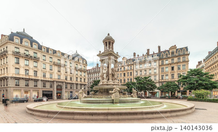 Hyperlapse of Place des Jacobins in Lyon, France, featuring the ornate Fontaine des Jacobins surrounded by historic buildings. 140143036