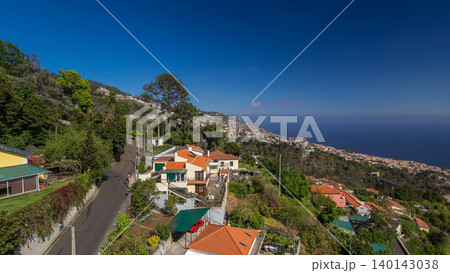 Aerial view from the mountain over the rooftops from cable car on Madeira timelapse hyperlapse. 140143038