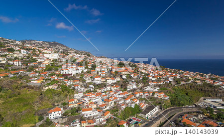 Aerial view from the mountain over the rooftops from cable car on Madeira timelapse hyperlapse. Aerial view from the mountain over the rooftops from cable car on Madeira timelapse hyperlapse. 140143039