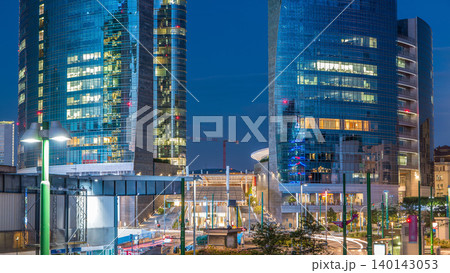 Milan skyline with modern skyscrapers in Porta Nuova business district day to night timelapse in Milan, Italy, after sunset. 140143053