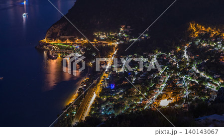 Day to night timelapse view of the Mediterranean coastline of the town of Eze village on the French Riviera Day to night timelapse view of the Mediterranean coastline of the town of Eze village on the French Riviera 140143067