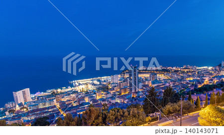 Cityscape of Monte Carlo, Monaco day to night timelapse with roofs of buildings after summer sunset. Cityscape of Monte Carlo, Monaco day to night timelapse with roofs of buildings after summer sunset. 140143071