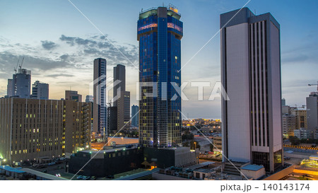 Skyline with Skyscrapers day to night timelapse in Kuwait City downtown illuminated at dusk. Kuwait City, Middle East Skyline with Skyscrapers day to night timelapse in Kuwait City downtown illuminated at dusk. Kuwait City, Middle East 140143174