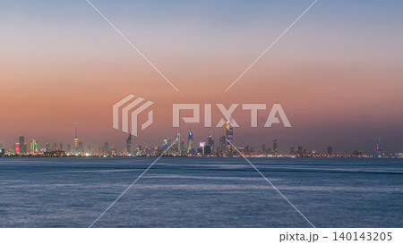 Skyline with Skyscrapers day to night timelapse in Kuwait City downtown illuminated at dusk. Kuwait City, Middle East Skyline with Skyscrapers day to night timelapse in Kuwait City downtown illuminated at dusk. Kuwait City, Middle East 140143205