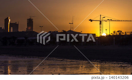 Seaside skyline of Kuwait city sunrise timelapse Seaside skyline of Kuwait city sunrise timelapse 140143206