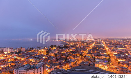 Panoramic skyline of Lima city from above with many buildings aerial night to day transition timelapse. Lima, Peru Panoramic skyline of Lima city from above with many buildings aerial night to day transition timelapse. Lima, Peru 140143224