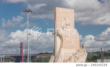 Monument of the Discoveries aerial timelapse, stone memorial and red 25 de Abril Bridge. Lisbon, Portugal Monument of the Discoveries aerial timelapse, stone memorial and red 25 de Abril Bridge. Lisbon, Portugal 140143234