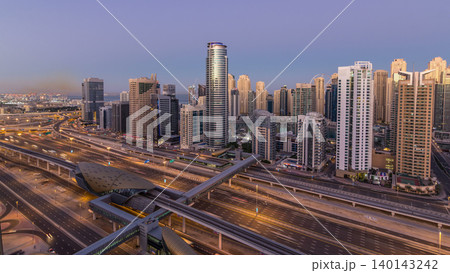 Dubai Marina skyscrapers aerial top view before sunrise from JLT in Dubai night to day timelapse, UAE. 140143242