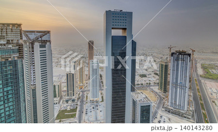 Skyscrapers at sunset timelapse in the skyline of commercial center of Doha, the capital Qatar Skyscrapers at sunset timelapse in the skyline of commercial center of Doha, the capital Qatar 140143280