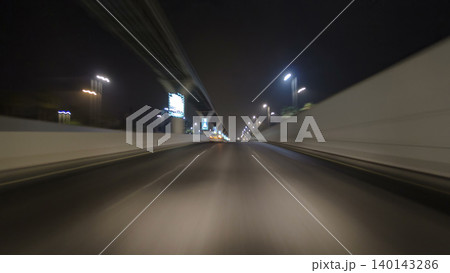 Road and tunnel on the Palm Jumeirah island in Dubai at night, UAE timelapse 140143286
