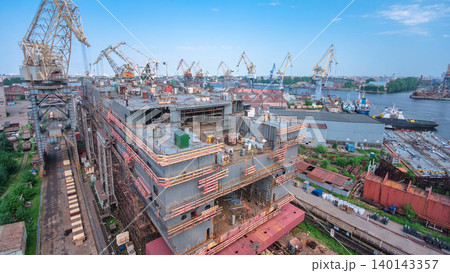 The construction of a large ship on a shipyard with cranes timelapse. The construction of a large ship on a shipyard with cranes timelapse. 140143357