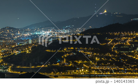 Barcelona and Badalona skyline with roofs of houses and sea on the horizon night timelapse Barcelona and Badalona skyline with roofs of houses and sea on the horizon night timelapse 140143365