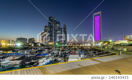 Al Bateen marina Abu Dhabi day to night timelapse with modern skyscrapers on background 140143455