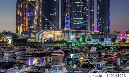 Al Bateen marina Abu Dhabi day to night timelapse with modern skyscrapers on background Al Bateen marina Abu Dhabi day to night timelapse with modern skyscrapers on background 140143458