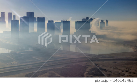 Skylines under the thick fog at the street timelapse of Abu Dhabi at morning Skylines under the thick fog at the street timelapse of Abu Dhabi at morning 140143463