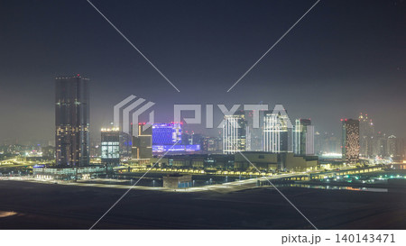 Buildings on Al Reem island in Abu Dhabi night timelapse from above. Buildings on Al Reem island in Abu Dhabi night timelapse from above. 140143471
