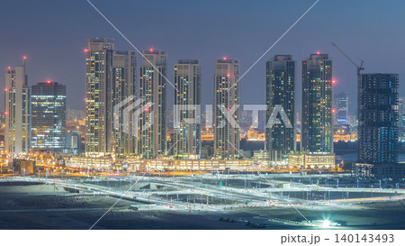 Buildings on Al Reem island in Abu Dhabi day to night timelapse from above. Buildings on Al Reem island in Abu Dhabi day to night timelapse from above. 140143493