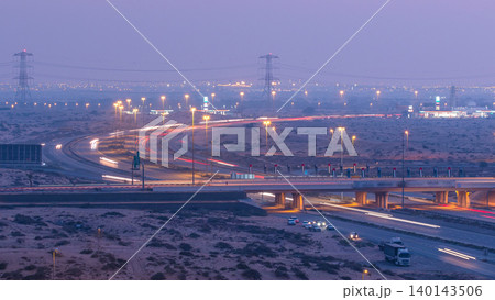Highway roads with traffic day to night timelapse in a big city from Ajman to Dubai before sunset. Transportation concept. Highway roads with traffic day to night timelapse in a big city from Ajman to Dubai before sunset. Transportation concept. 140143506