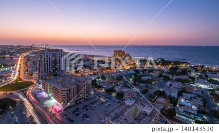 Cityscape of Ajman and Sharjah day to night timelapse from top Cityscape of Ajman and Sharjah day to night timelapse from top 140143510