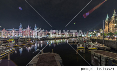 Panorama showing illuminated Central Railway station night timelapse. Amsterdam, The Netherlands Panorama showing illuminated Central Railway station night timelapse. Amsterdam, The Netherlands 140143524