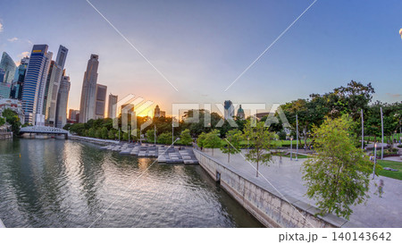Sunset over Singapore skyscrapers skyline with white Anderson Bridge near esplanade park timelapse. Sunset over Singapore skyscrapers skyline with white Anderson Bridge near esplanade park timelapse. 140143642