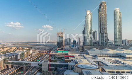 Aerial view of Financial center road timelapse with under construction building 140143663