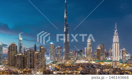 Dubai Downtown skyline day to night timelapse with Burj Khalifa and other towers panoramic view from the top in Dubai Dubai Downtown skyline day to night timelapse with Burj Khalifa and other towers panoramic view from the top in Dubai 140143668