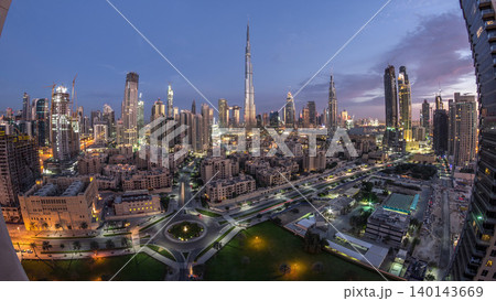 Dubai Downtown skyline night to day timelapse with Burj Khalifa and other towers panoramic view from the top in Dubai Dubai Downtown skyline night to day timelapse with Burj Khalifa and other towers panoramic view from the top in Dubai 140143669