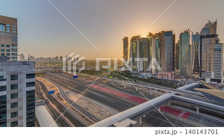Aerial top view to Sheikh Zayed road during sunrise near Dubai Marina and JLT timelapse, Dubai. Aerial top view to Sheikh Zayed road during sunrise near Dubai Marina and JLT timelapse, Dubai. 140143701