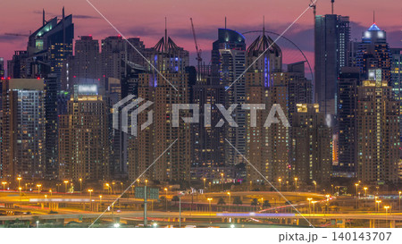 Dubai Marina skyscrapers and golf course day to night timelapse, Dubai, United Arab Emirates Dubai Marina skyscrapers and golf course day to night timelapse, Dubai, United Arab Emirates 140143707