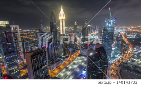 Skyline of the buildings of Sheikh Zayed Road and DIFC aerial night timelapse in Dubai, UAE. Skyline of the buildings of Sheikh Zayed Road and DIFC aerial night timelapse in Dubai, UAE. 140143732