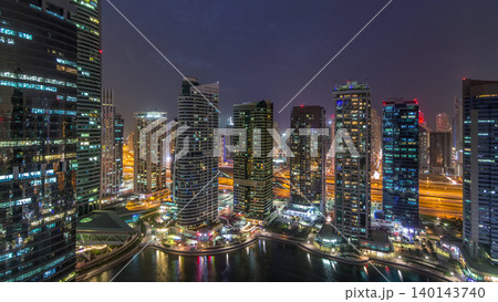 Residential and office buildings in Jumeirah lake towers district day to night timelapse in Dubai Residential and office buildings in Jumeirah lake towers district day to night timelapse in Dubai 140143740