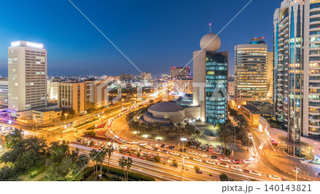 Dubai Creek area surrounded by modern buildings and busy traffic street day to night timelapse 140143821