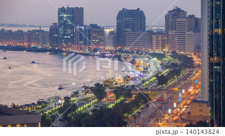 Dubai creek landscape day to night timelapse with boats and ship near waterfront Dubai creek landscape day to night timelapse with boats and ship near waterfront 140143824