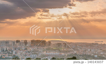 Panoramic sunrise view over Lisbon and Almada from a viewpoint in Monsanto morning timelapse. Panoramic sunrise view over Lisbon and Almada from a viewpoint in Monsanto morning timelapse. 140143837