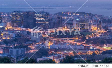 Panoramic view over Lisbon and Almada from a viewpoint in Monsanto night to day timelapse. Panoramic view over Lisbon and Almada from a viewpoint in Monsanto night to day timelapse. 140143838