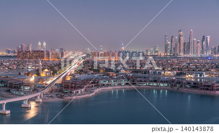 Jumeirah Palm island skyline day to night timelapse in Dubai, UAE. Jumeirah Palm island skyline day to night timelapse in Dubai, UAE. 140143878