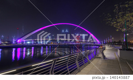 Pedestrian Bridge over the Dubai Water Canal night timelapse hyperlapse, United Arab Emirates 140143887