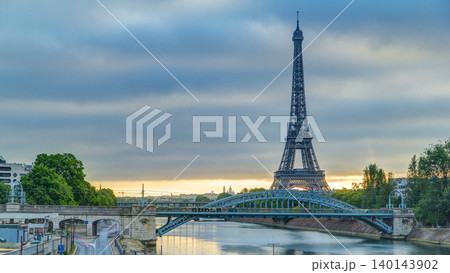 Eiffel Tower sunrise timelapse with boats on Seine river and in Paris, France. Eiffel Tower sunrise timelapse with boats on Seine river and in Paris, France. 140143902